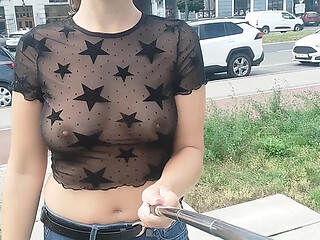 Hot babe shows off perky tits in see-through blouse