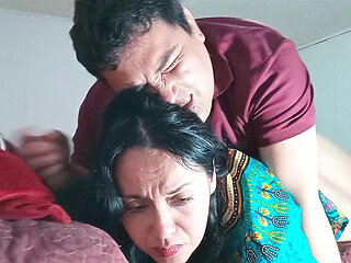 Indian stepmother shares bed with her stepson, they end up fucking hard.