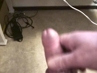 My Friend Sits in a Chair and Jerks off His Cock While Watching Video