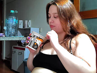Hot Chubby Woman Filling Her Round Belly with Some Sweets