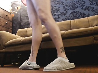 Large house slippers and socks play in room