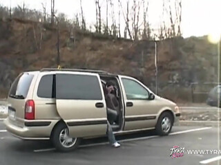 Brunette with Tattoos Gives Blowjob in Car Backseat