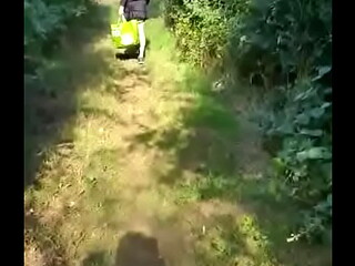 gay crossdresser takes a walk in public dressed up like a girl but soon runs away when he hears two people near by