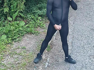 Wank and cum outdoors wearing a spandex bodysuit