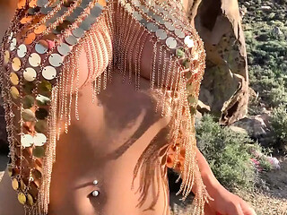 The Golden Princess pleasures herself outdoors.