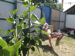 A Platinum Blonde Amateur Puts Down Her Book to Masturbate in a Hammock Outdoors