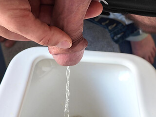 closeup pissing in urinal with big uncut dick