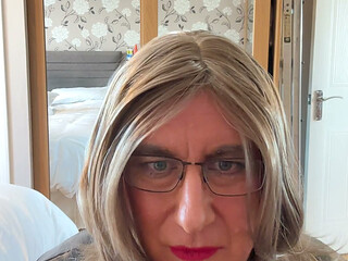 sexy Sissy crossdresser wearing a sexy Black leather playsuit waiting for you to fuck her as she plays with herself.