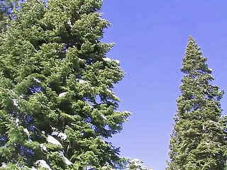 Slim Tahoe gives a sloppy blowjob to her muscular mountain man outdoors