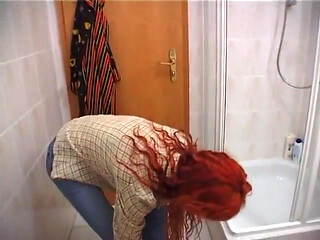 Redhead beauty showering solo
