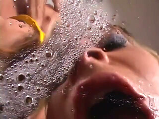 Horny stud enjoys his dick sucked by two sexy babes