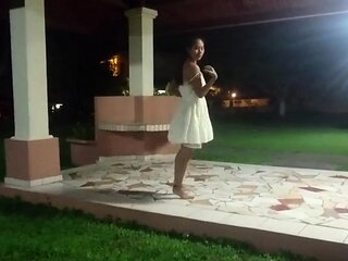 Tiny-titted Asian babe plays with herself outdoors