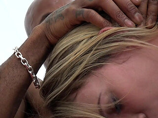 She wraps her lips around his dark pole, eager to enjoy a wild interracial banging