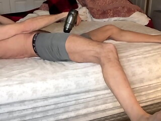 Stretching Tension in Bed with Massage Gun in on Bed in Tight Boxer Briefs July 2024