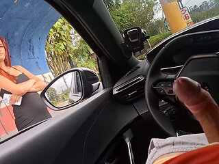 Risky handjob in the car for hottie at the bus stop in public!