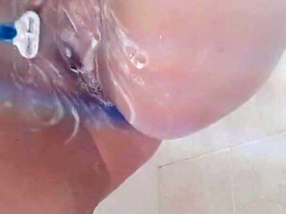 Teen Shaves Her Perfect Pussy While Bathing and Masturbates with the Shaver