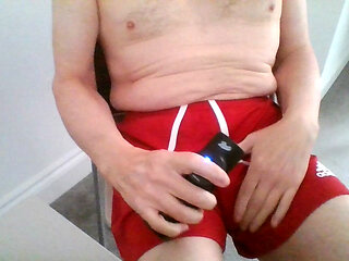 Wank in red shorts