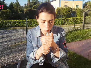 Petra smokes her ciggaretes outdoor