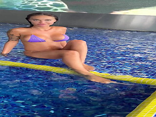 Monika Fox In Purple Bikini Swims In Pool &amp_ Poses By Window Against Background Of City (Free)