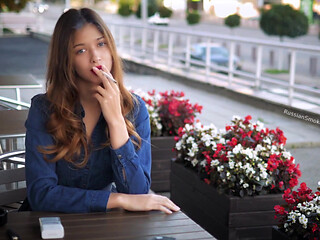 Magnetic Russian Beauty Playing with Cigarette Smoke