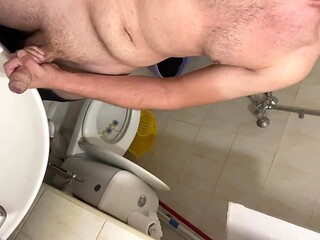 Tall European guy sticks his cock in the bathroom mirror