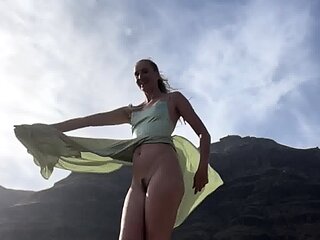 Blonde amateur enjoys the feeling of masturbating outdoors