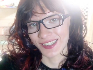 Master feminizes his sissy in chastity, giving her spankings and engaging in dirty talk.