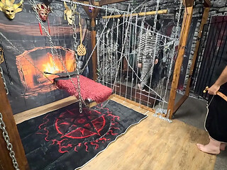 Master and submissive explore BDSM in the dungeon