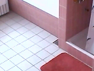 Amateur blonde masturbates on toilet