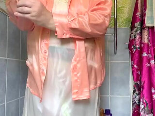 In vintage maid attire to take a bath fully dressed and to remove her outfit