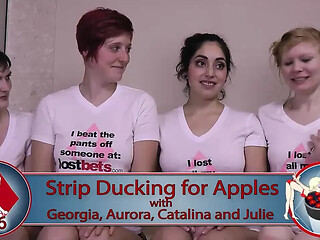 Wet lesbians play stripping apple bobbing game