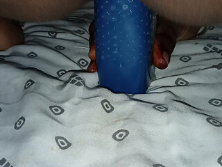 Inserting the bottle deep into the
