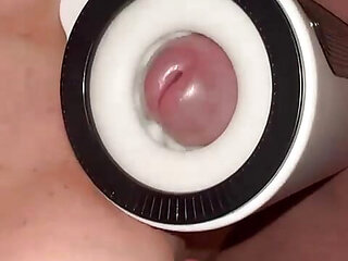 He titty fucks me and the masturbator toy makes him shoot a huge load on my face