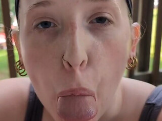 Blonde beauty giving a wet blowjob on the patio