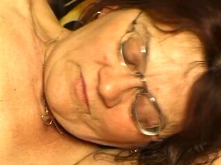 Hairy GILF in Glasses Gags on Big Cock