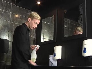 Inked blond fella deepthroats a twink in the bathroom