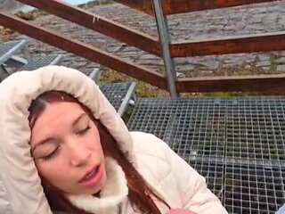 Slutty redhead gives a nice blowjob to an older guy outdoor and takes his cum in her mouth