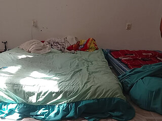 Mexican mother-in-law cleaning guest room in thong