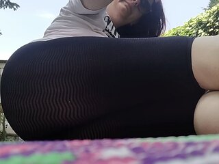 Italian woman dirty feet in the garden and transparent yoga pants