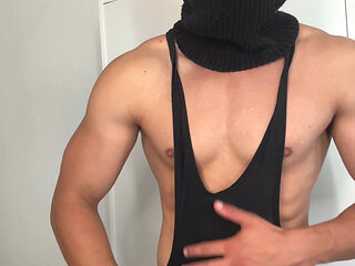 Muscle hunk teasing in a tight singlet