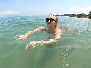 Lovita Fate is a naughty angel in sexy micro bikini on the beach