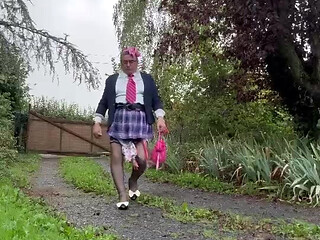 Dressed in a little pink plaid skirt for a party
