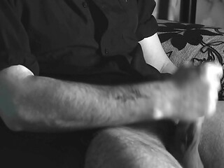 The boy jerks off close-up with a condom and cums loudly into it.