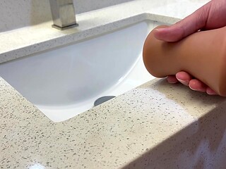 Hot wife pees on her hubby's thick cock in a hotel bathroom