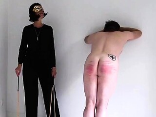 Pitiful slave spanked hard by merciless MILF mistress