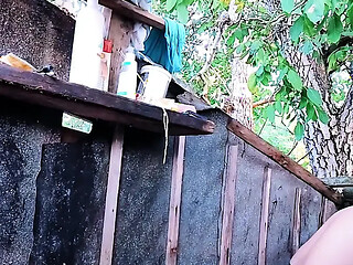 Real amateur MILF gives a blowjob in a public outdoor shower with big