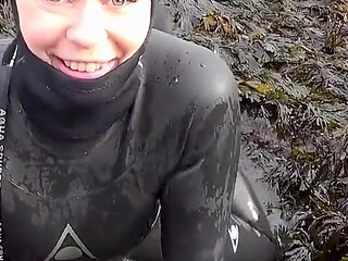 Rubbery Beach Encounter: Lucy's Neoprene Pussy Play with Stranger