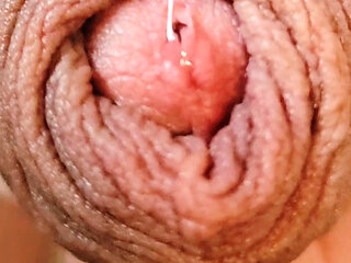 Close-up precum and cum horny uncut guy playing with long foreskin cumshot