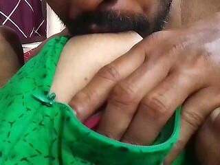 Her husband is sucking the Indian Malayali girl's breasts.