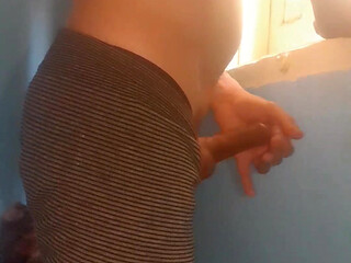 Masturbating while watching my neighbor through the window